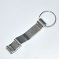 Close-up of a silver aluminum tiger-shaped beer bottle opener keychain on a white background - Silver
