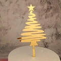Detail of a gold mirror acrylic Christmas tree cake topper on a white marble background - Style 207 / Mirror Gold