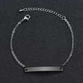 Close-up of minimalist stainless steel ID bracelet with rectangular plate and lobster clasp - Black