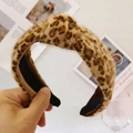 Detail of plush leopard print headband with a stylish knotted top and soft faux fur texture - Khaki Leopard (Unwrapped Ends)