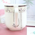 Pulsera ajustable de mariposa plateada con circonitas brillantes en el asa de una taza - Plateado