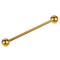 Close-up of a polished gold industrial barbell earring with smooth dual spheres - Gold