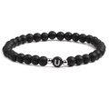 Detail shot of black matte stone bracelet with letter U bead and silver accents - Letter U
