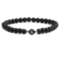 Detail of matte black beaded bracelet with letter G charm and silver metal spacers - Letter G
