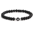 Detail of 6mm matte black stone beads with silver spacers and letter W heart bead - Letter W