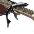 Shark shaped guitar capo in black zinc alloy attached to an acoustic guitar neck - Blister Packaging / Gunmetal