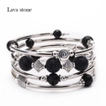 Multi-layer wrap bracelet featuring black lava stone beads and silver metallic accents - Lava Stone Style