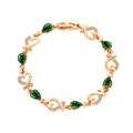 Close-up of rose gold heart link bracelet with green teardrop crystal and zircons - Dark Green