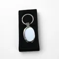 Porte-clés ovale en métal argenté avec plaque aluminium dans son coffret cadeau noir - Ellipse