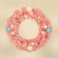 Pink macaron Christmas wreath featuring pastel ornaments and white berry accents - 50cm