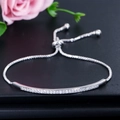 Detail of adjustable silver bolo bracelet featuring curved bar with white zircons - Silver