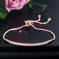 Adjustable rose gold curved bracelet with micro-paved sparkling cubic zirconia stones - Rose Gold