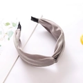 Elegant grey satin headband with twisted knot design on clean white background - Gray