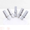 Five small silver wooden clips for photos with durable metal springs on a white base - Silver
