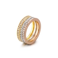 Elegante conjunto de anillos de tres capas en oro, plata y oro rosa con pavé de circonitas - US 7 / Tricolor