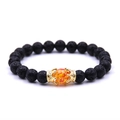 Beaded crown bracelet featuring black lava rock stones and an orange centerpiece bead - Lava Stone Gold