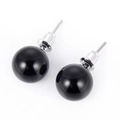 Detail of 10mm round black natural stone stud earrings with silver-plated needle and smooth finish - Black Agate