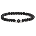 Close-up of matte black bead bracelet with letter T charm and silver spacers - Letter T