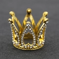 Macro detail of a golden alloy crown with sparkling rhinestones on a dark textured background - Mini Full Rhinestone Gold