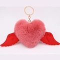 Close-up of heart-shaped plush keychain with red wings and golden metal ring - Gold Keychain / Dust Rose