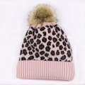 Pink leopard print knitted beanie for women featuring a fluffy faux fur pompom top - Light Pink