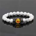 White marble bead crown bracelet with yellow amber accent on reflective background - White Turquoise