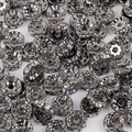 Flat gunmetal spacer beads with clear rhinestones for DIY jewelry making - Diameter 4mm / Gun Black with White Rhinestones