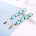 Detail shot of golden barrette hair clips with emerald green turquoise square stones - Rectangle Antique Gold