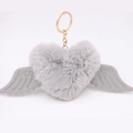 Detail of grey plush heart keychain with soft wings and a golden metal ring - Gold Keychain / Light Gray