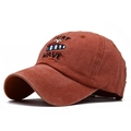 Washed cotton baseball cap in rust red featuring surf wave embroidery and retro style - Orange