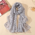 Classic black and white leopard chiffon scarf styled with pearls and fashion magazine - White