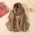 Classic leopard print chiffon scarf for women shown with stylish fashion accessories - Khaki