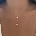 Double-layered gold necklace featuring a pearl pendant and small metal heart charm - Double Layer Pearl Heart Style