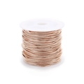 Detail of rose gold snake chain on white spool for jewelry making and DIY projects - Rose Gold