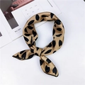 Elegant gold square silk scarf with black heart patterns tied in a chic bow knot - Bronze Gold Black Heart