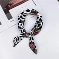 Floral and leopard print silk scarf for women in a chic knotted style on white background - White Leopard Floral