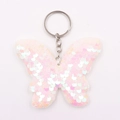 Détail de sequins réversibles rose et blanc sur porte-clés papillon avec anneau - Anneaux de Jonction Argentés / Blanc Irisé