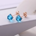Sky blue cube crystal stud earrings with a rose gold base in a minimalist design - Blue Crystal/Rose Gold