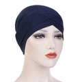 Detail of navy blue stretch turban cap featuring a criss-cross front and knit texture - Navy Blue