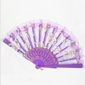 Close-up of purple lace folding fan with gold rose embroidery on white background - Purple