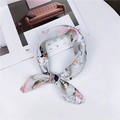 Elegant light grey floral silk square scarf tied in a bow on a white surface - Light Grey Pink Floral