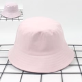 Reversible bucket hat featuring light pink solid side and pink white plaid check pattern - M (56-58cm) / Pink / Pink-White Plaid