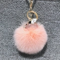 Pink plush ball keychain with a sparkling rhinestone flying pig and golden metal ring - Pink Pig + Pom Pom / Pink