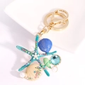 Llavero de estrella de mar con cristales, conchas azules y perlas blancas - Azul