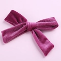 Detailed texture of a 5-inch deep purple velvet bow hair clip with crocodile attachment - Rose Red