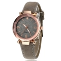 Detailed close-up of rose gold polygonal case and grey glitter dial on quartz watch - Gray