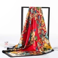 Detail of red Baroque silk scarf with gold patterns and magazine on white backdrop - 80-100cm / Red