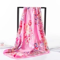 Detail of pink silk scarf with floral and paisley patterns hanging on a black frame - 80-100cm / Pink