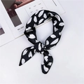 Elegant black and white polka dot silk square scarf tied in a stylish bowknot knot - Black White Abstract Dot