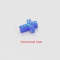 Macro detail of blue cross-shaped opal bead with horizontal hole and shimmering texture - Blue No.3 - Horizontal Hole